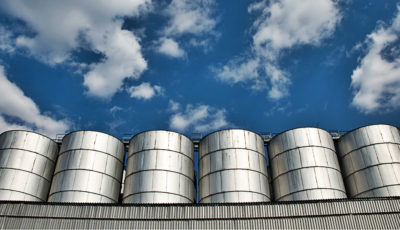 more silos and blue sky with clouds